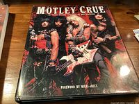 Front cover of the Motley Crue hardcover book