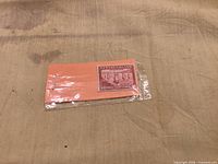 Stamp in plastic sleeve on backing card