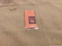 Front view of the mint Newfoundland 7¢ Princess Elizabeth stamp in protective sleeve