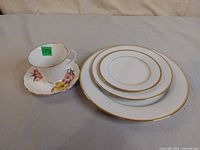 Group shot of Noritake plates, teacup on Royal Vale saucer