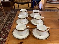 Six Paragon Clarence cups each on matching saucer displayed on table