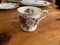 Full view of Paragon bone china mug with floral design and gold trim