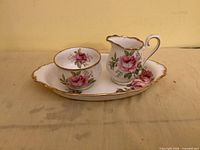 Cream pitcher, sugar bowl and tray showing full pattern and condition