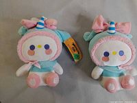 Front view of both Cinnamoroll unicorn plush toys