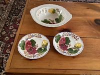 Vegetable bowl and two bread plates showing floral Belle Fiore design