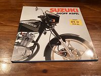 Front cover showing title, author and motorcycle image