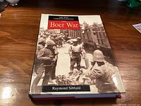 Front view of hardcover book showing full title, author and cover photo