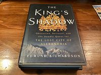 Front view of hardcover book The King's Shadow showing dust jacket