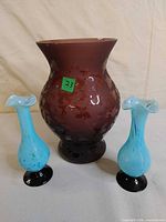 Front view of all three vases showing size comparison and colors