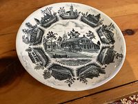 Front view of Meakin dinner plate showing Upper Canada Village design