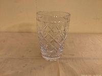 Clear cut crystal vase on flat surface