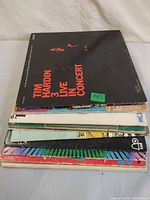 Stack of ten LP records showing quantity and spines