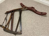 Overall view of ox yoke and stacked wooden frame saws