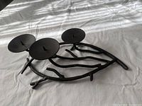 Full view of branch-style candle holder showing three candle plates