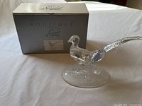 Figurine and original box shown together