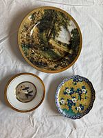 Three plates: rural landscape, bird motif, cloisonné floral