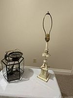 Pendant lantern and table lamp positioned on a table