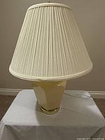 Front view showing entire lamp, shade, base and cord