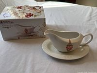 Gravy boat on saucer beside original Maxwell & Williams Baubles box