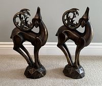 Front view of both deer statues standing side by side