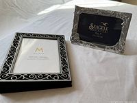 Seagull Pewter 5x7 frame and Mantles album frame on white surface