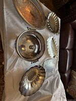 Group shot of all six silver-plated serving pieces