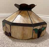 Overall view of stained glass ceiling lamp shade showing design, colors and structure