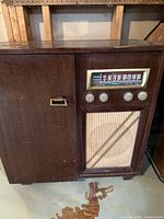 Full view of Addison radio cabinet with speaker cloth and side door