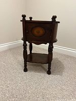 Full view of wooden smoking stand showing humidor cabinet, turned legs, lower shelf