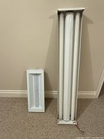 Both fixtures side by side showing relative size and form