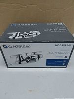 Retail box showing brand, model and faucet image