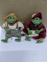 Front view of both Russ frog figurines displaying outfits and resin limbs