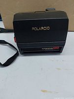 Camera closed front view showing Polaroid logo and Autofocus 660 label
