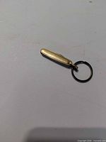 Closed brass pocket knife with key ring