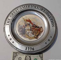 front view showing text, image and scale with dollar bill