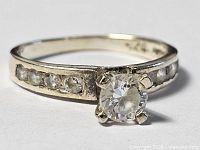 Top view of sterling silver ring showing central stone and accent stones