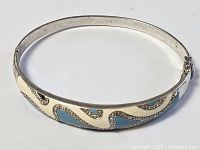 Full view of silver-tone enamel wave bangle bracelet