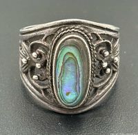Front view showing abalone shell cabochon and filigree
