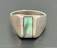 Front view of sterling silver ring showing rectangular abalone inlay