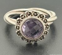 Front view showing amethyst and floral bezel