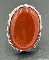 Front view showing oval carnelian and bezel