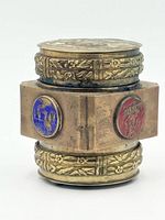 Side view showing blue crane and red dragon/phoenix enamel medallions with floral repoussé bands