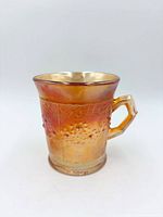 Side view showing Orange Tree pattern and iridescent marigold finish