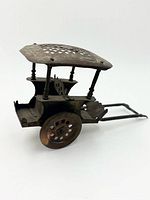 Left side view showing canopy, wheels, shafts