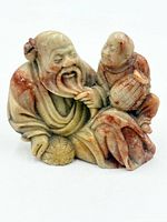 Front view of Shoushan stone carving showing elder with child, basket and gourd