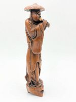 front view of carved wood figurine