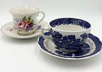 Blue willow and pink rose tea cup and saucer sets