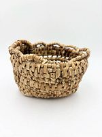 Front view showing coiled weave and scalloped rim