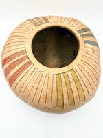 Top view showing narrow mouth and multicolor etched pattern