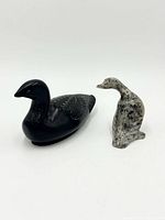 Front view of both soapstone bird figurines